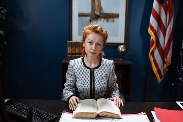 Photo by RDNE Stock project: https://www.pexels.com/photo/woman-in-white-and-black-long-sleeves-and-red-earrings-holding-an-open-book-6172543/