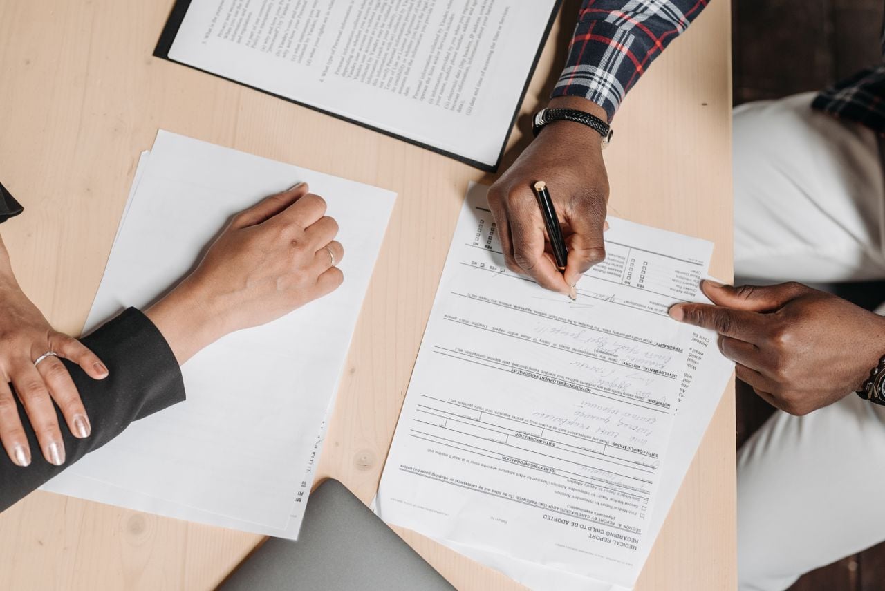 Photo by Pavel Danilyuk: https://www.pexels.com/photo/people-doing-paperwork-at-a-desk-8152735/